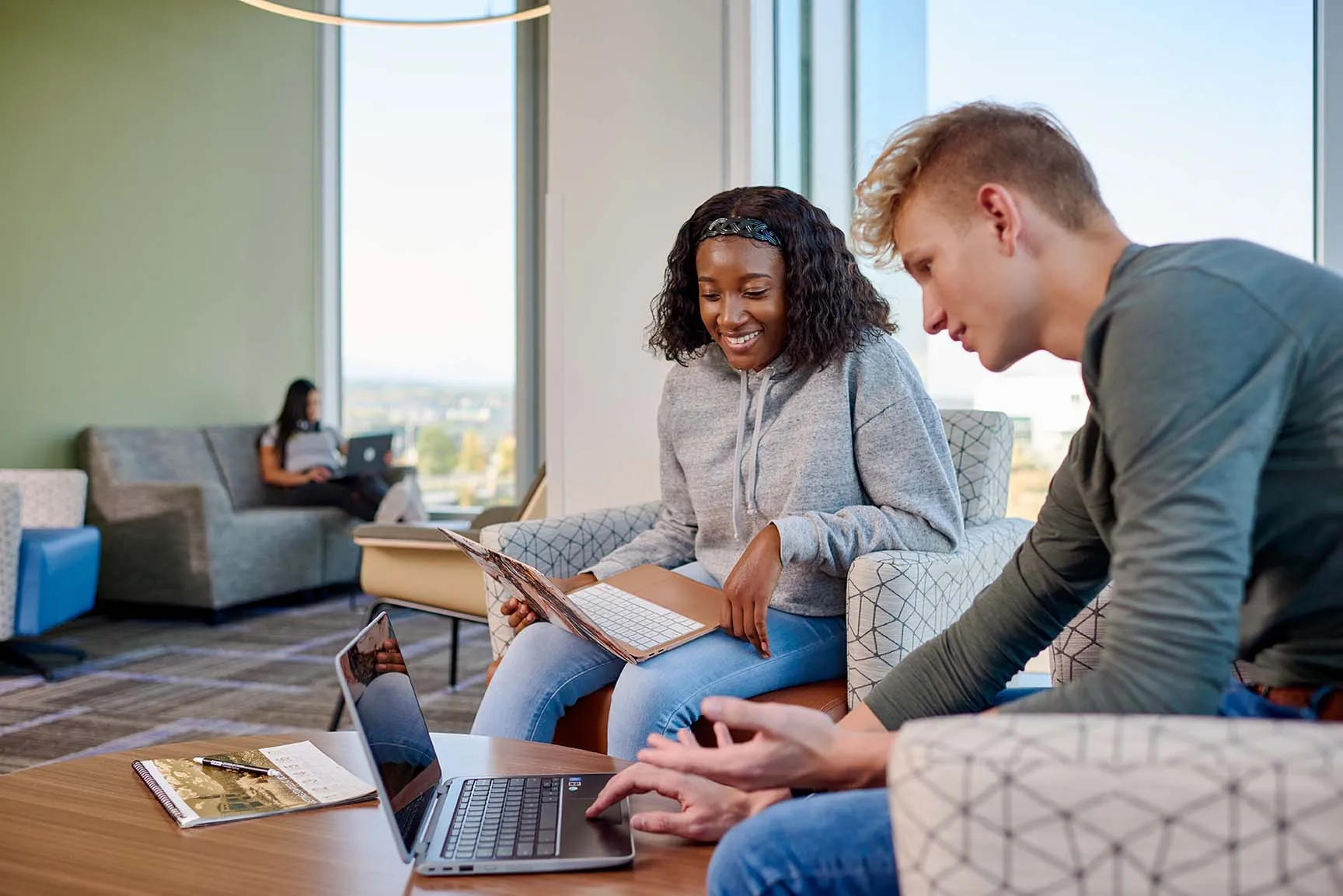 Two students studying with laptop